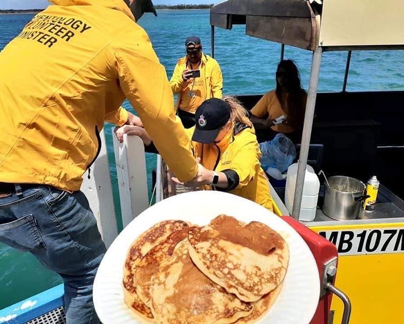 The Volunteer Ministers cooked banana pancakes on the bright yellow BBQ boat.
